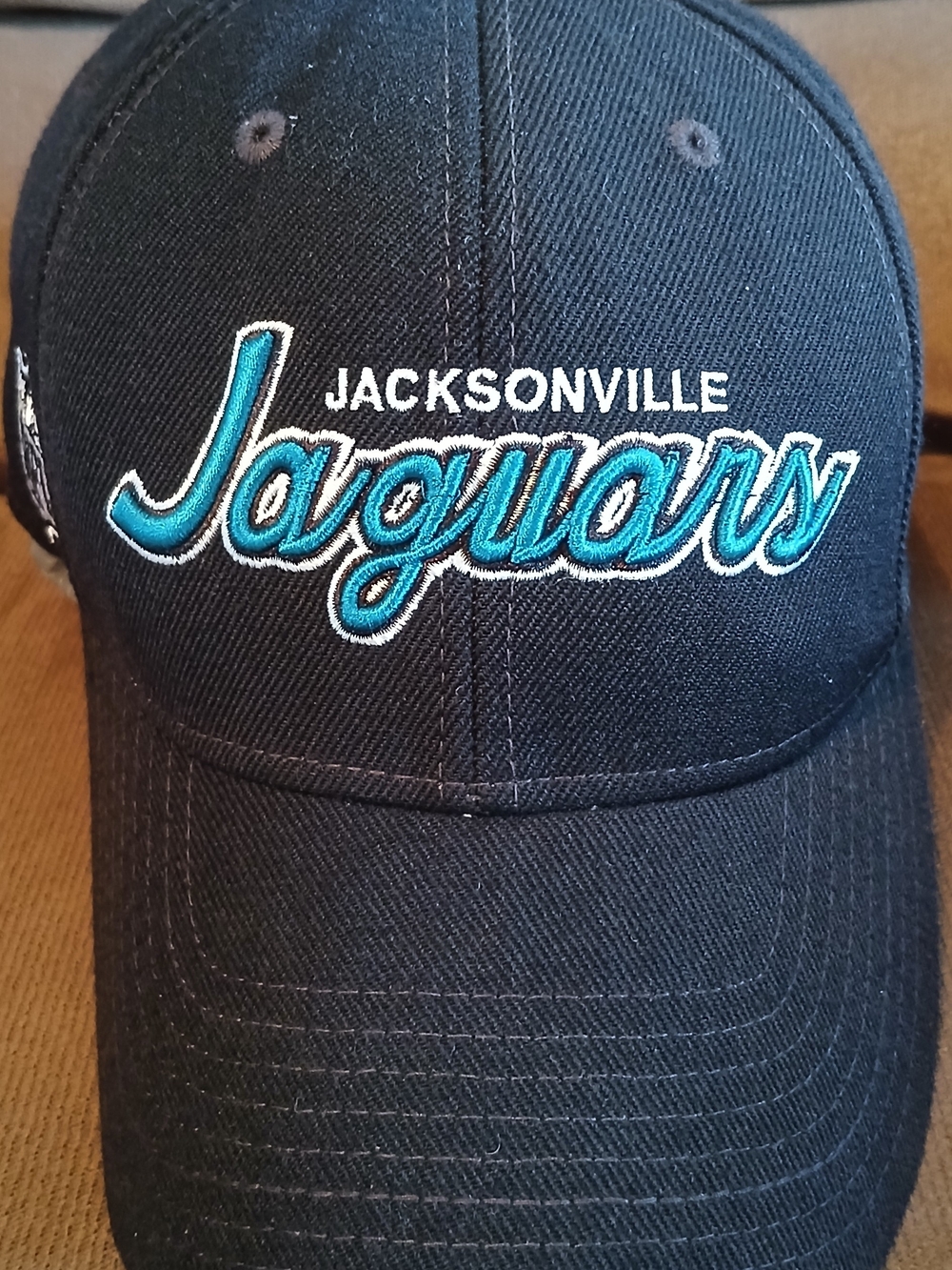 Jacksonville Jaguars Black Baseball Cap with Teal Script